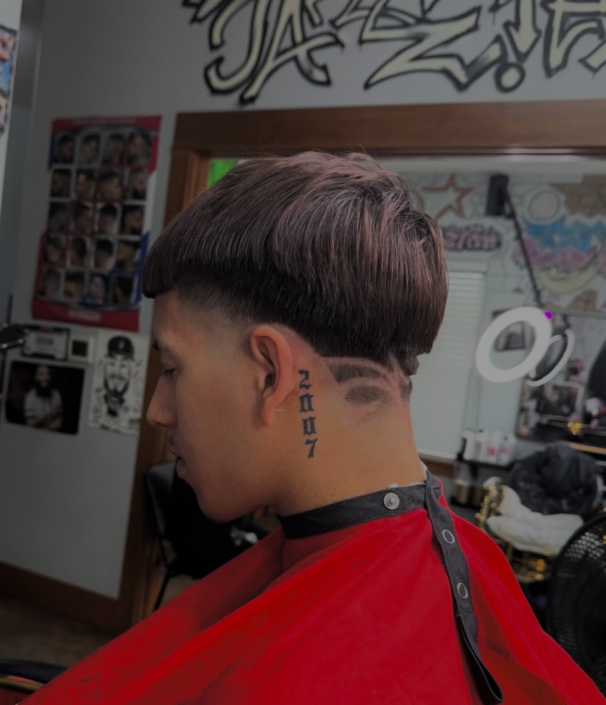 Low taper fade finished in the chair at Jazzie's