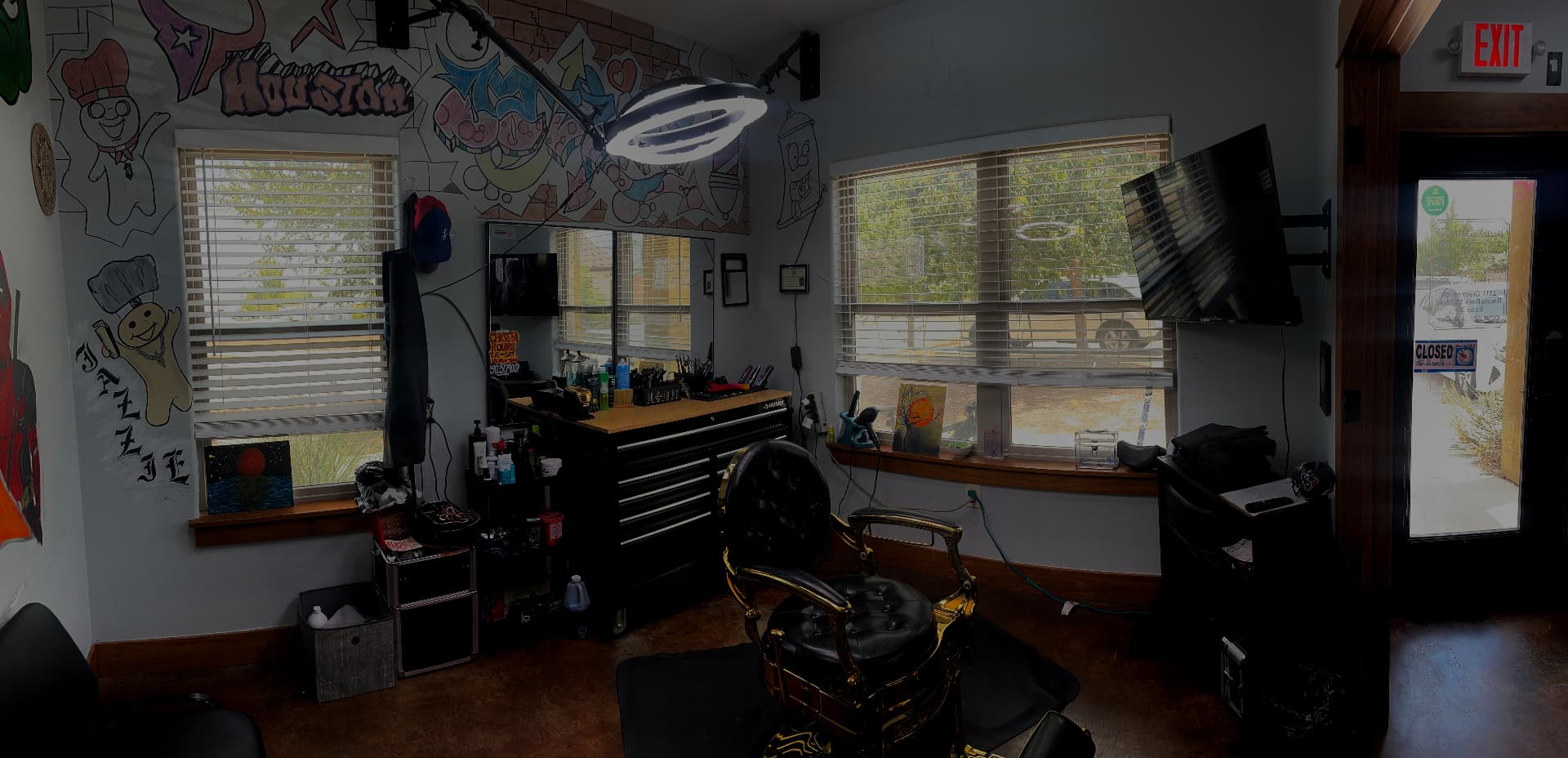 Inside Jazzie's Barbershop with its barber chair and wall art